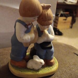 Charming Figurine with Children and Rabbit
